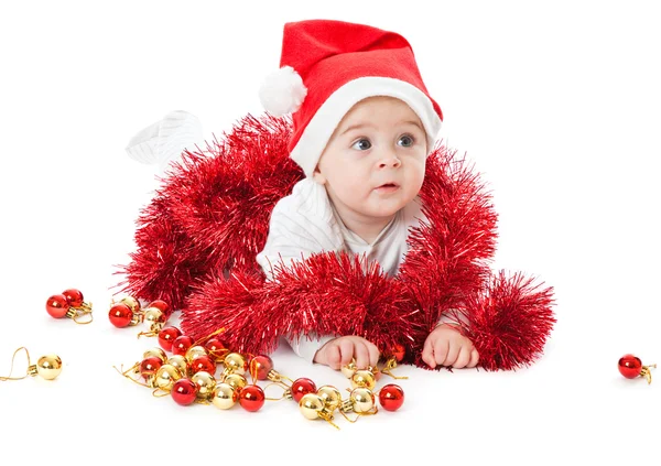 Mały chłopiec ubrany kapelusz santa i playi — Zdjęcie stockowe