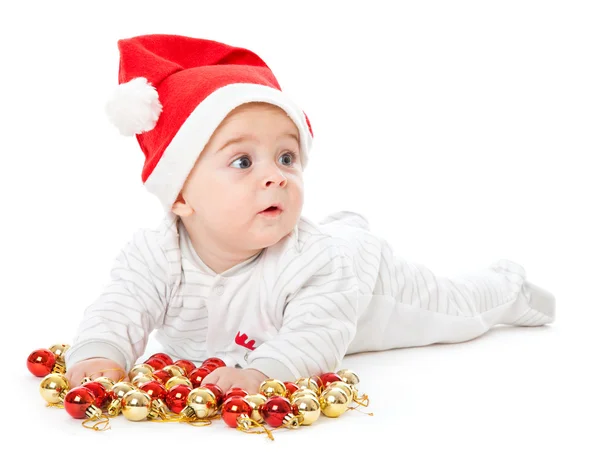 小男孩穿上圣诞老人的帽子和 playi — 图库照片