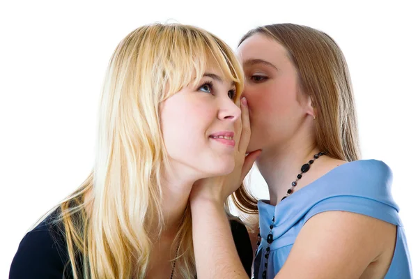 Two happy young girlfriends telling secr — Stock Photo, Image