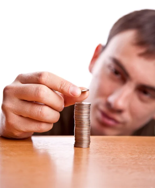 Man and pile of coins — Stock Photo, Image