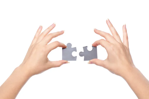 두 개의 퍼즐으로 손 — 스톡 사진
