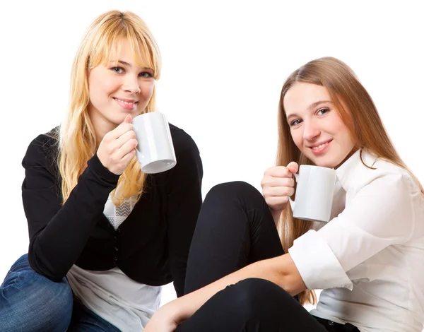 Two teenage girls is drinking tea — Stock Photo, Image