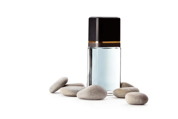 Piedras y frasco con perfume —  Fotos de Stock