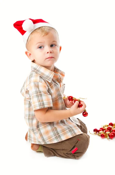 Kleine jongen dragen een kerstmuts en playi — Stok fotoğraf