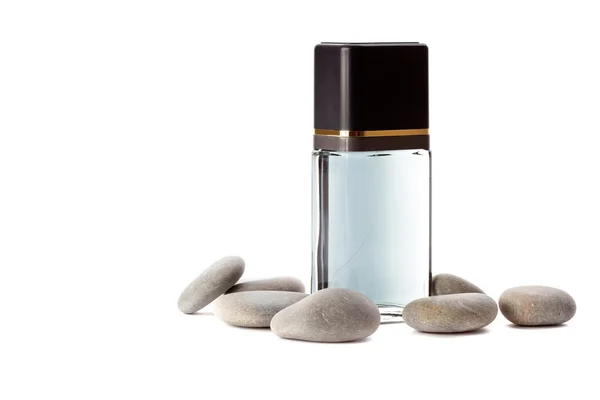 Piedras y frasco con perfume — Foto de Stock