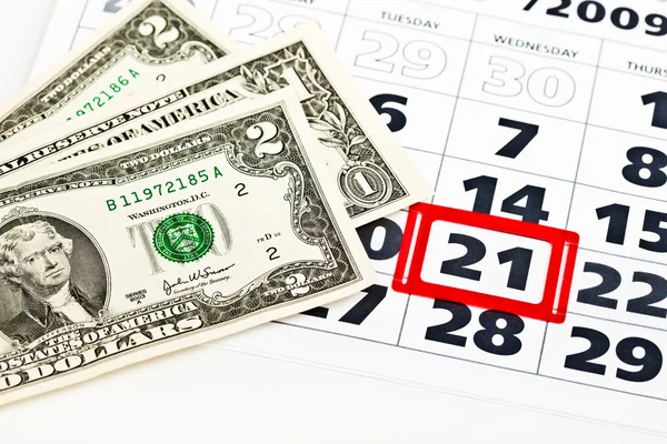 Dollar bills on calendar — Stock Photo, Image