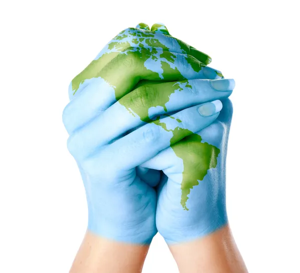 Map of world painted on hands — Stock Photo, Image