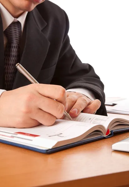 Biznesmen ręce, pisanie w organizatorze — Zdjęcie stockowe