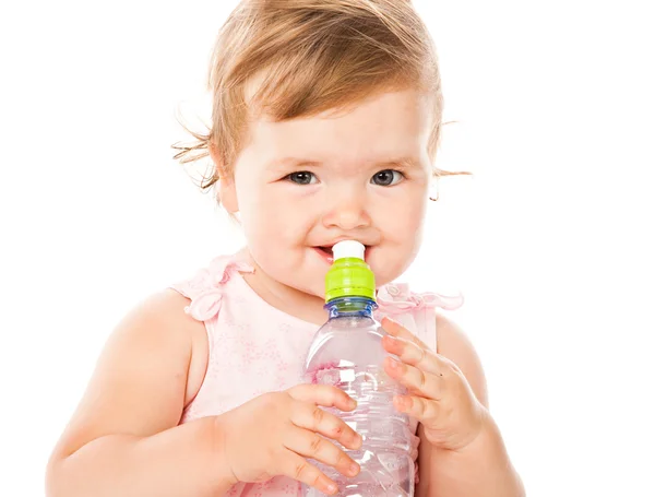 Little girl is drinking from bottle — Stock Photo, Image