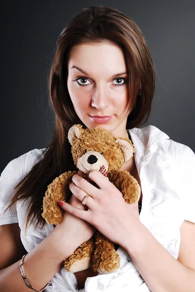 Pretty model with toy bear — Stock Photo, Image