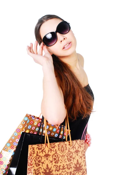 Gelukkig vrouw in zonnebril op winkelen — Stockfoto