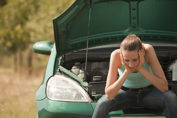 Sad woman with broken car — Stock Photo, Image