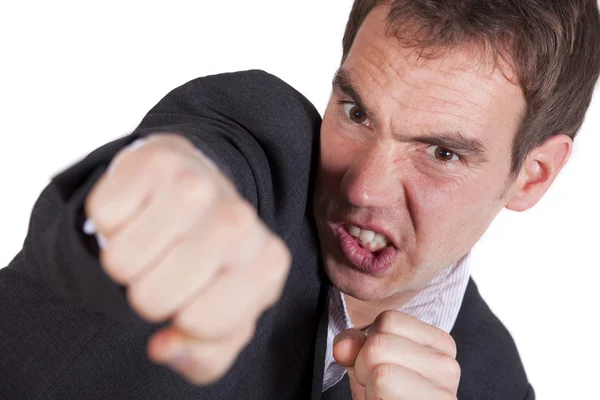 Angry man punching — Stockfoto