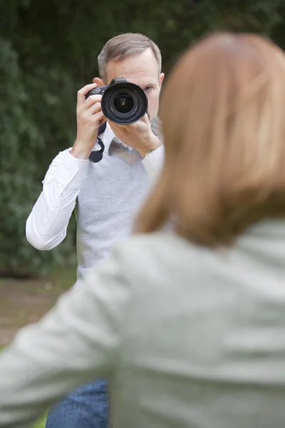Photographer takes a picture from woman — Stock Photo, Image