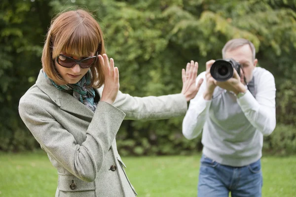 Paparazzi takes a picture from woman — Stock Photo, Image