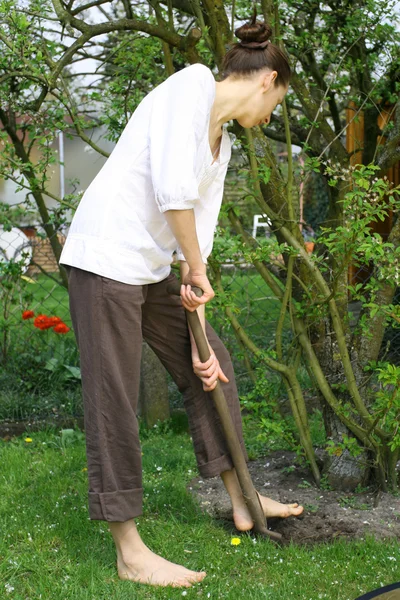 Woman with shovel — Stock Photo, Image