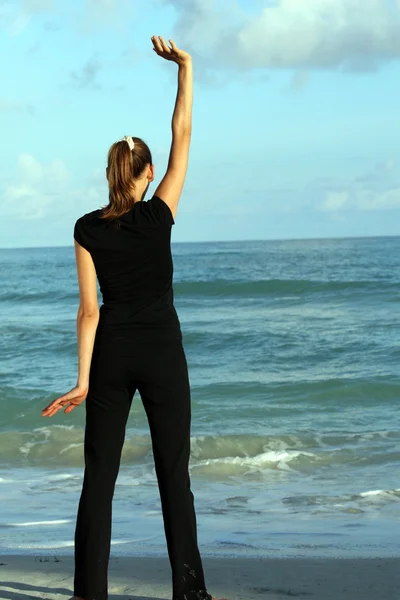 Stretching on the beach — Stock Photo, Image