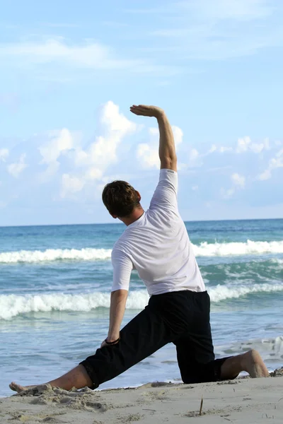 Stretching on the beach — Stock Photo, Image