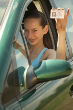 Woman with driving permit clipart