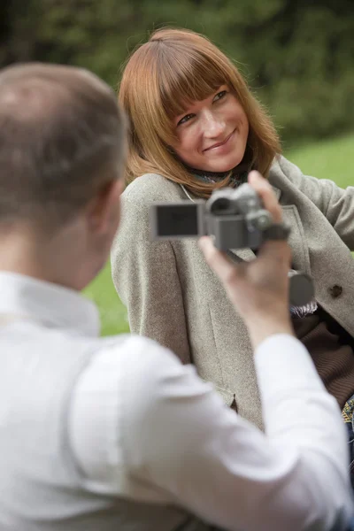 Man with video camera filming — Stock Photo, Image