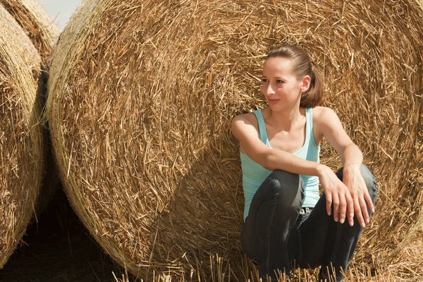 Woman in straw — Stock Photo, Image