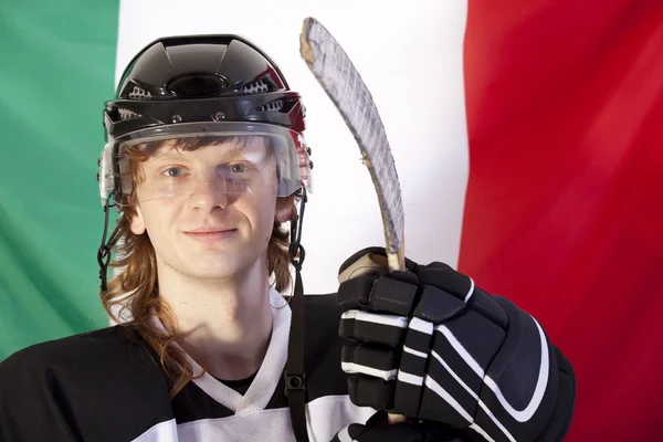 Ice hockey player over italian flag — Stock Photo, Image