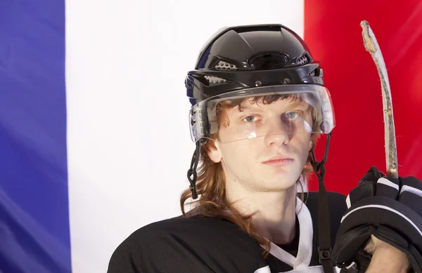 Joueur de hockey sur glace sur drapeau france — Photo