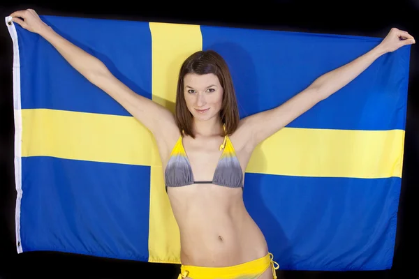 Frau mit schwedischer Fahne — Stockfoto