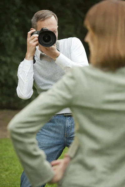 Photographer takes picture from girl — Stock Photo, Image