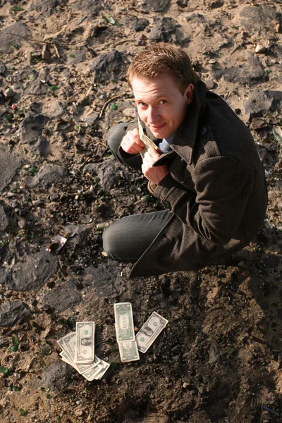 Man with money outdoor — Stock Photo, Image