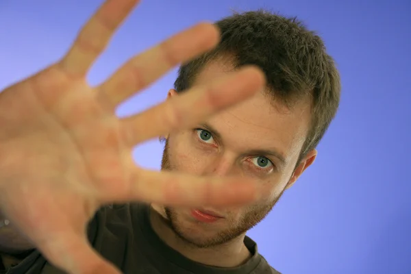 Man looking through his hand — Stock Photo, Image