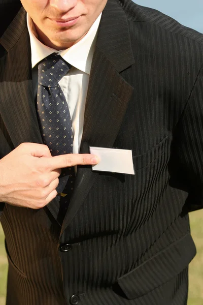 Empresário apontando no cartão vazio — Fotografia de Stock