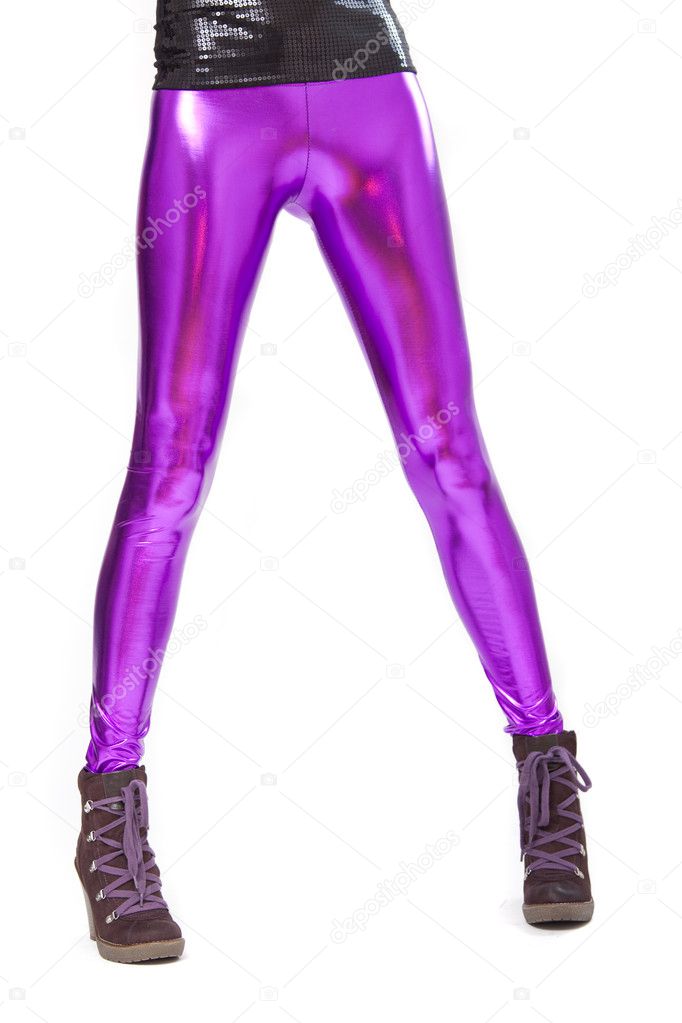 Woman legs in shiny leggings