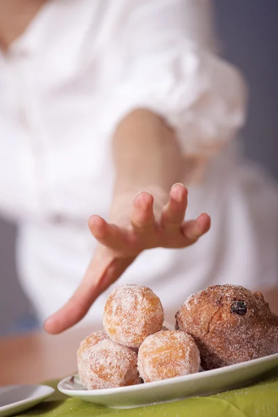 Reaching for cakes — Stock Photo, Image