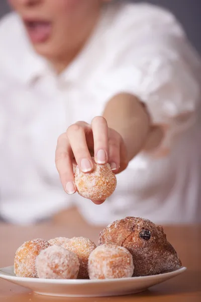stock image Woman reaches for sugar cake