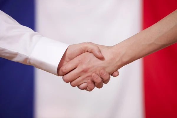 stock image Hand shake over france flag