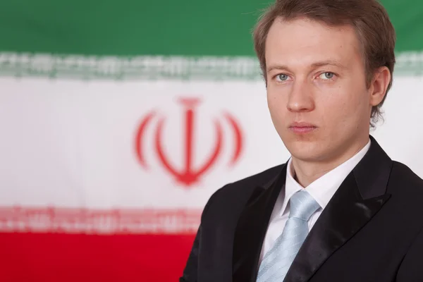 Geschäftsmann wegen iranischer Flagge — Stockfoto