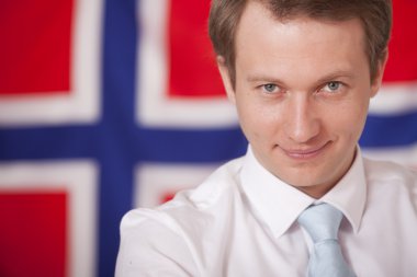 Businessman over norwegian flag clipart