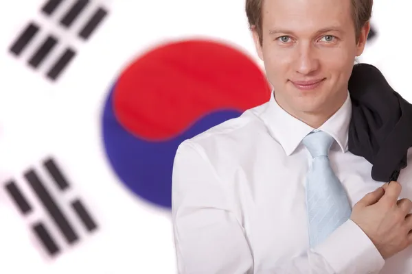 Mies Etelä-Korean lipun yllä — kuvapankkivalokuva