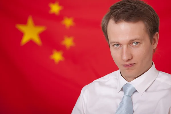 stock image Politician over china flag