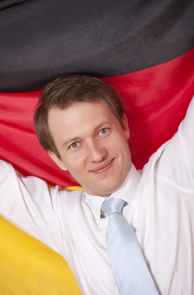 Uomo fanatico con bandiera tedesca — Foto Stock
