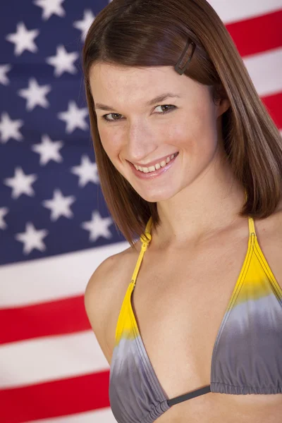 Mujer sobre bandera americana —  Fotos de Stock