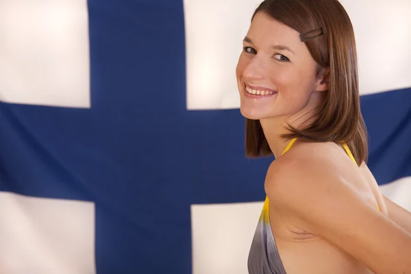 Mulher sobre bandeira finlandesa — Fotografia de Stock