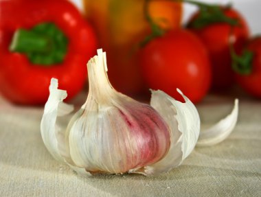 Garlic in front of vegetables clipart