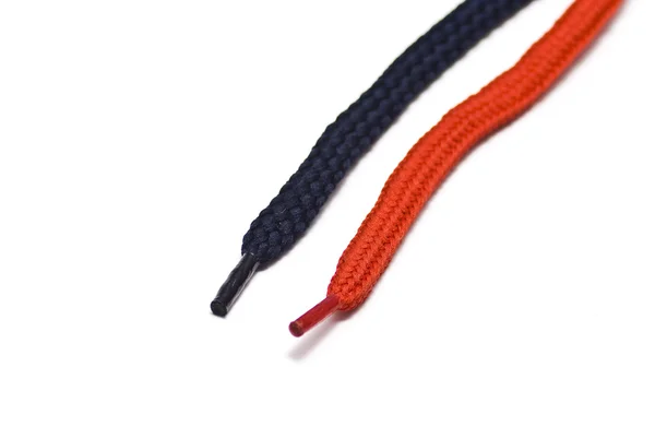 black shoelaces with red tips