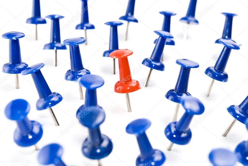 One red thumbtack amid blue thumbtacks ⬇ Stock Photo, Image by