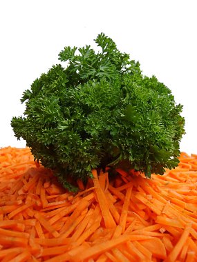 Bunch of parsley and cut carrot clipart