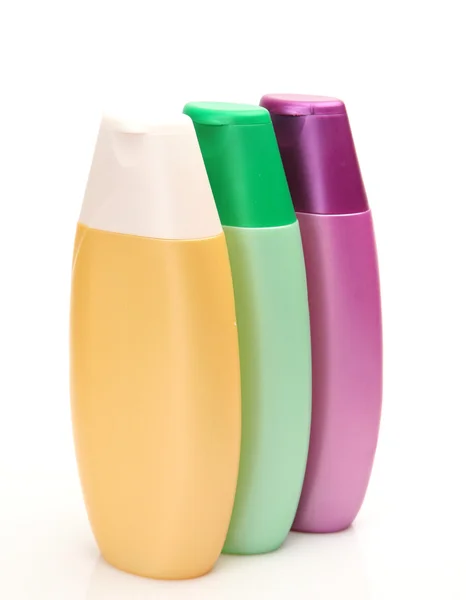 Botellas de color sobre fondo blanco — Foto de Stock