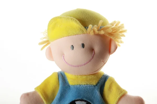 Zacht stuk speelgoed - glimlachend jongen in kleur doek, — Stockfoto