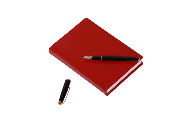 Rotes Tagebuchbuch über weißem Stockbild
